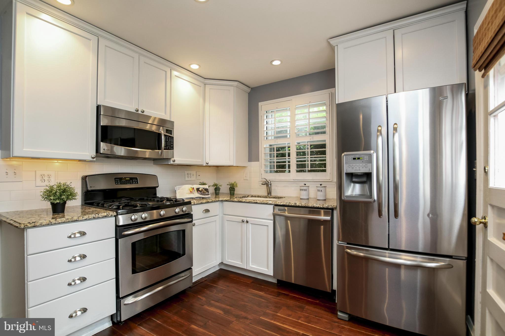 116 Croydon Road Baltimore, MD 21212 - Photo 9 of 30 a kitchen with stainless steel appliances a refrigerator sink and microwave