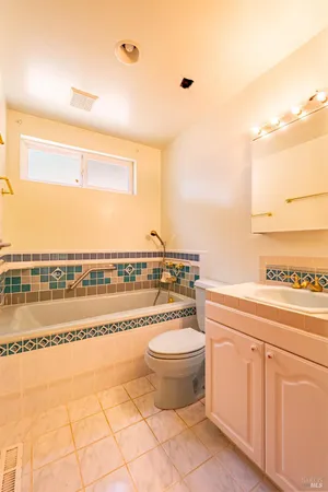a bathroom with a toilet a sink and a shower