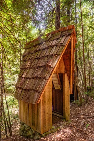 a view of a house with a tree