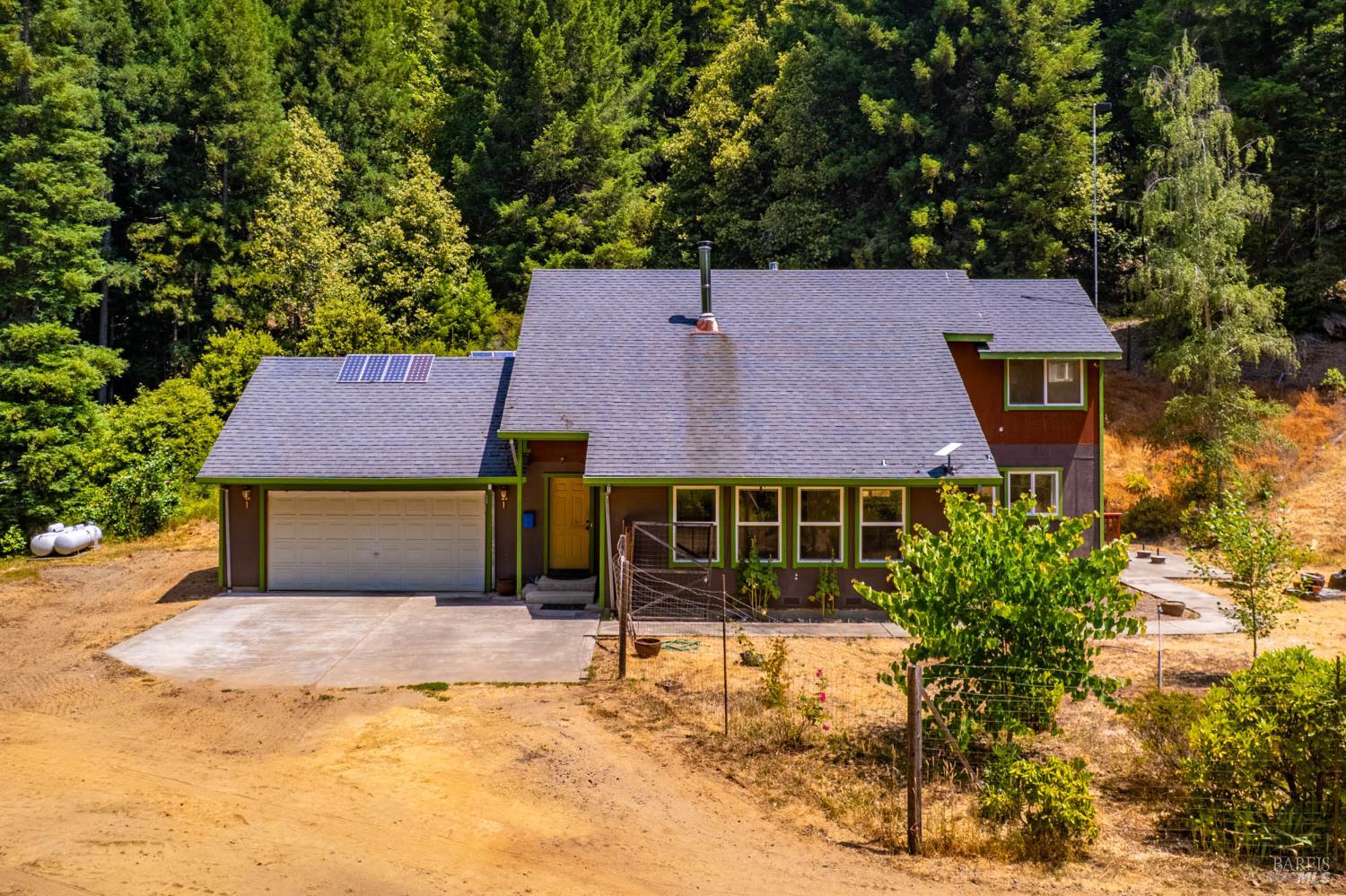 44150 Nash Mill Road Philo, CA 95466 - Photo 3 of 29 a house that has a tree in front of it