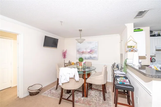 a view of a dining room with furniture window and outside view