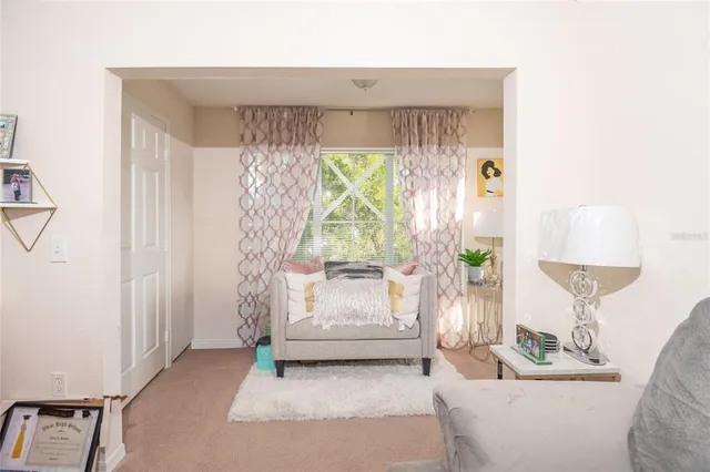 a living room with furniture and a window