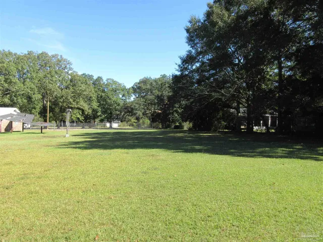 a view of a swimming pool and an outdoor space