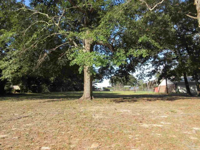 a view of swimming pool with a yard