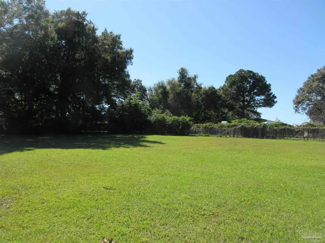 a view of outdoor space with deck and yard