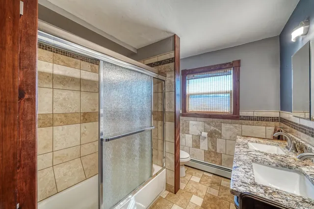 a bathroom with a bathtub and a shower