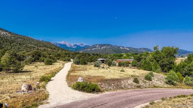 a view of a ocean with a mountain in the background