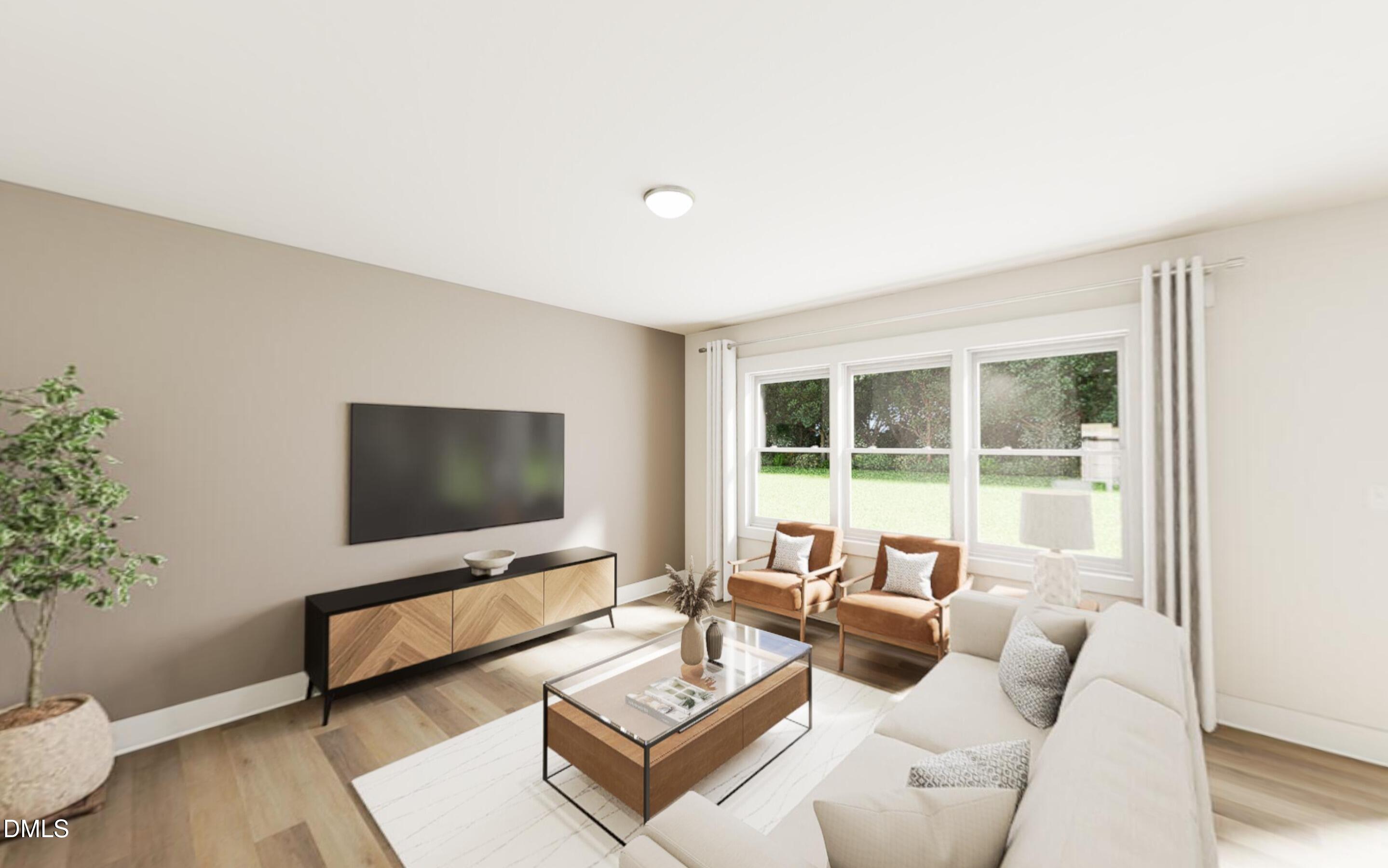 2015 Pollinator Place Mebane, NC 27302 - Photo 6 of 24 a living room with furniture and a flat screen tv