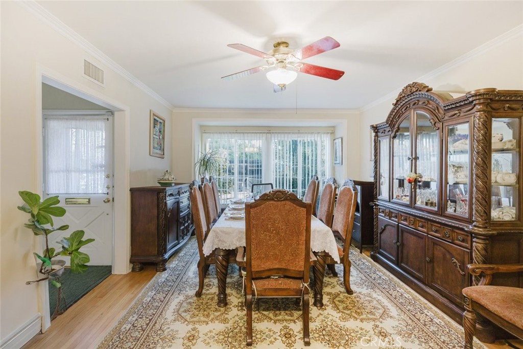 15439 Hart Street Van Nuys, CA 91406 - Photo 11 of 32 a view of a dining room with furniture window and wooden floor