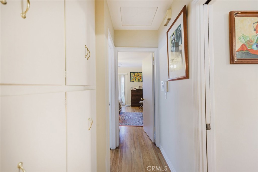 15439 Hart Street Van Nuys, CA 91406 - Photo 14 of 32 a view of a hallway with wooden floor and closet