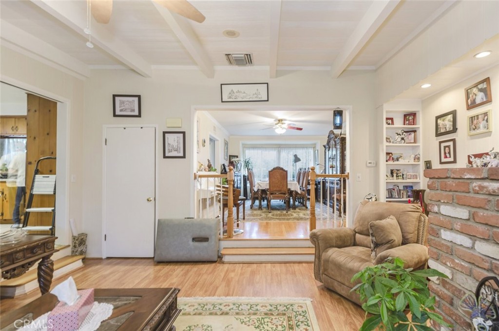 15439 Hart Street Van Nuys, CA 91406 - Photo 18 of 32 a living room with furniture and a flat screen tv