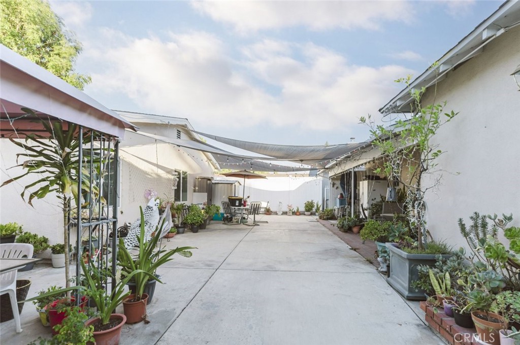 15439 Hart Street Van Nuys, CA 91406 - Photo 21 of 32 a view of a porch with potted plants