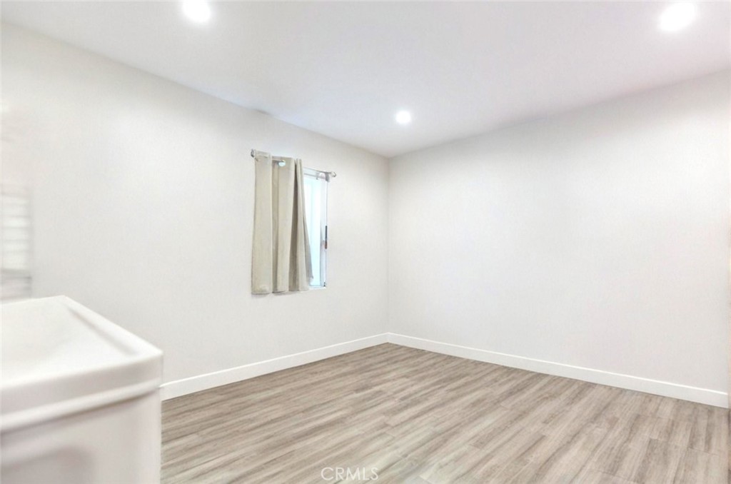 15439 Hart Street Van Nuys, CA 91406 - Photo 25 of 32 a view of an empty room and wooden floor