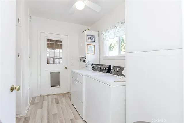 a utility room with closet dryer and washer