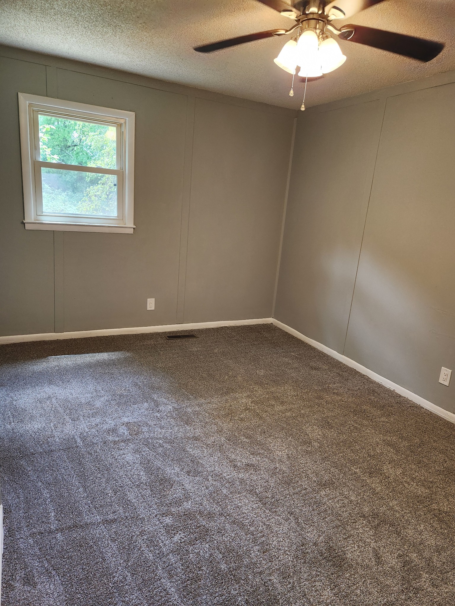 3262 Prospect Road Pulaski, TN 38478 - Photo 15 of 23 an empty room with a chandelier fan