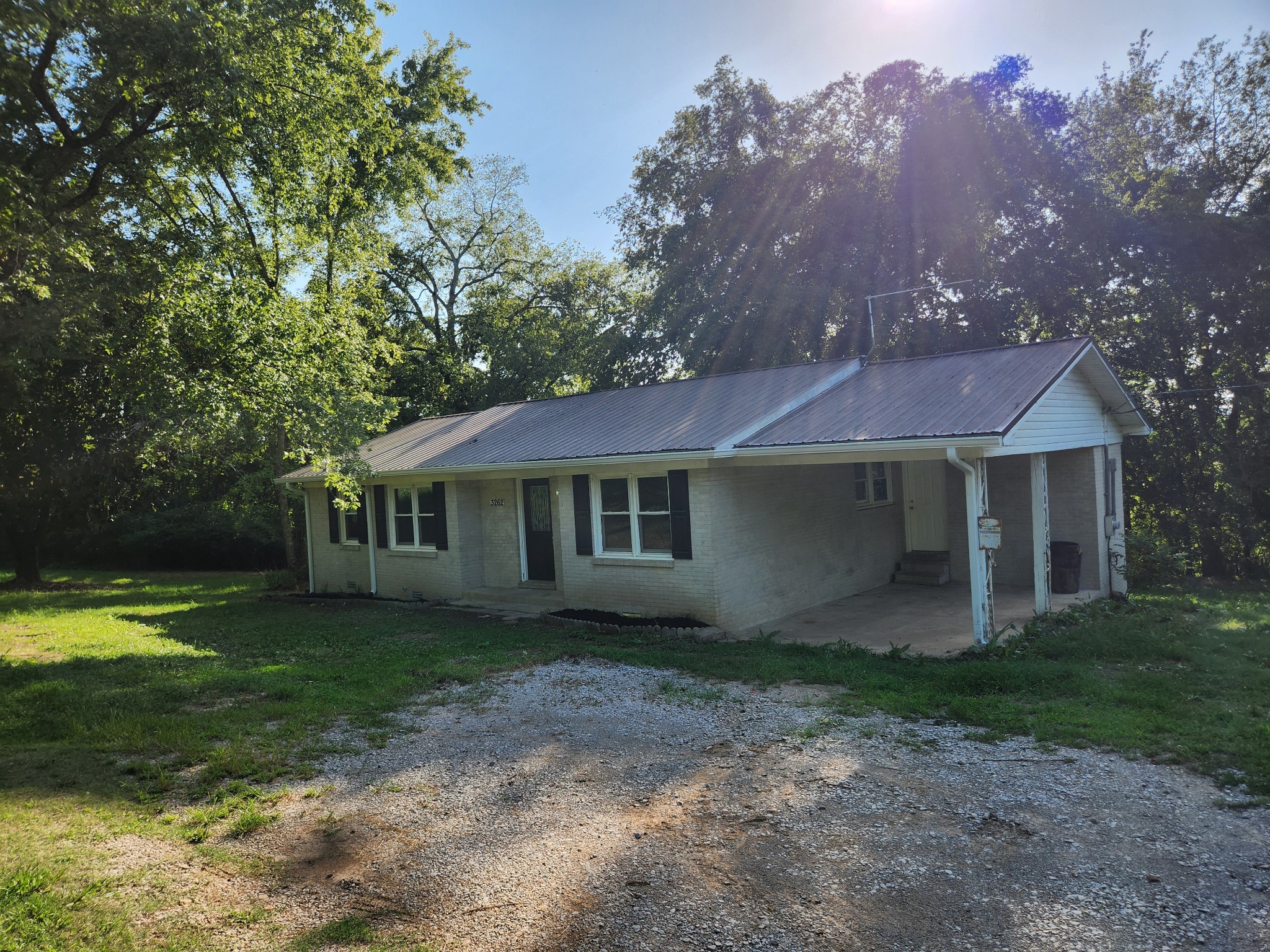 3262 Prospect Road Pulaski, TN 38478 - Photo 2 of 23 a front view of a house with garden