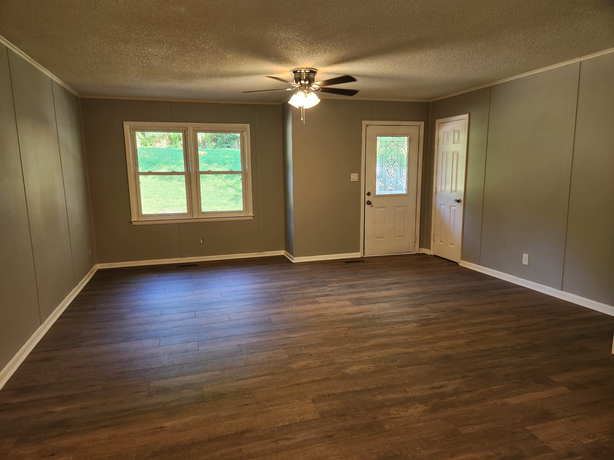3262 Prospect Road Pulaski, TN 38478 - Photo 4 of 23 an empty room with wooden floor and windows