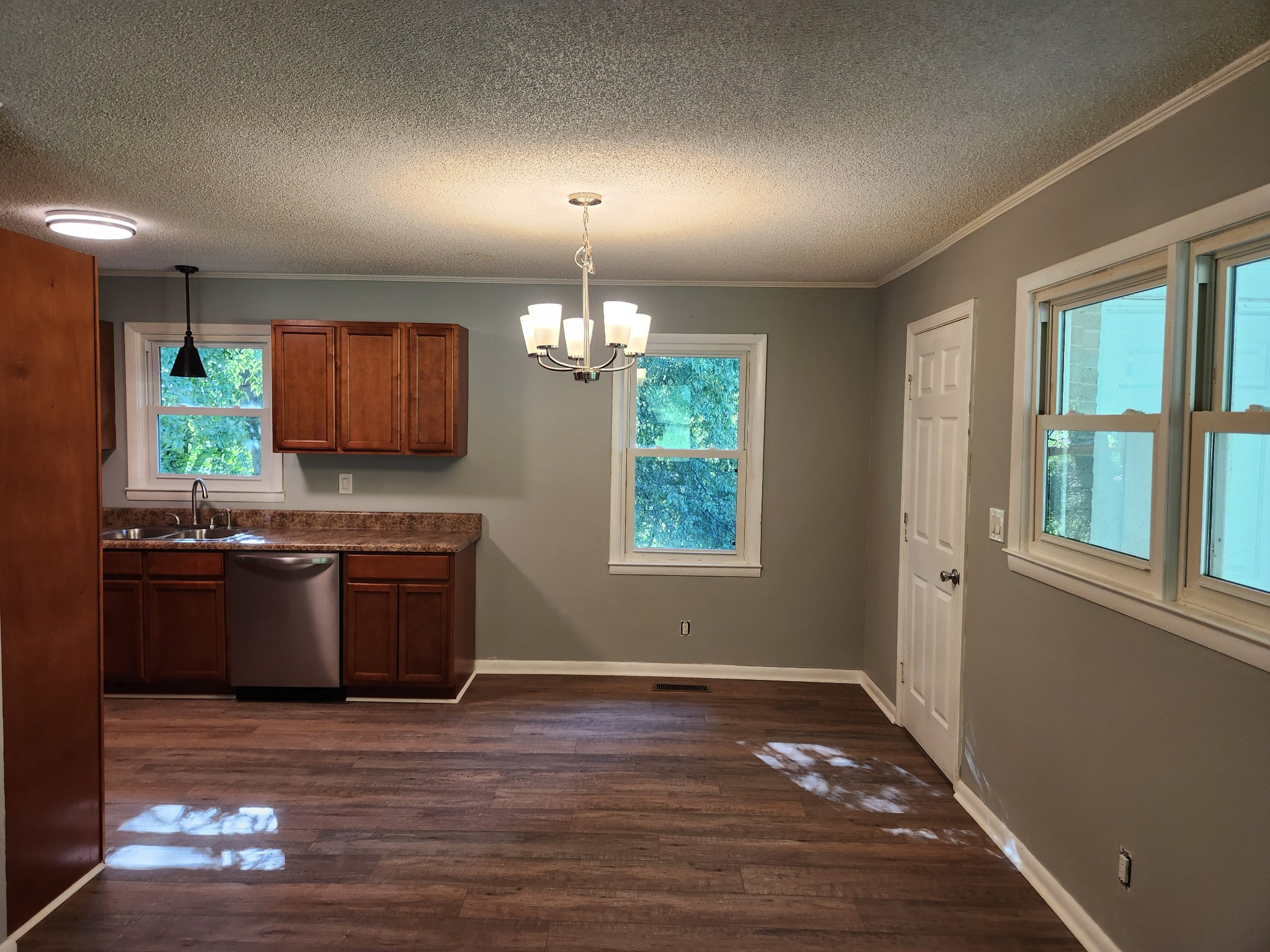 3262 Prospect Road Pulaski, TN 38478 - Photo 9 of 23 a kitchen with stainless steel appliances granite countertop a sink stove and wooden floor