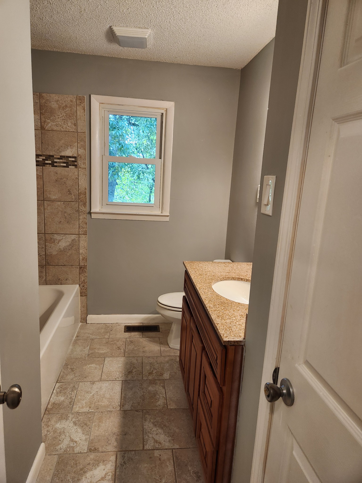 3262 Prospect Road Pulaski, TN 38478 - Photo 10 of 23 a bathroom with a sink a toilet a window and tub