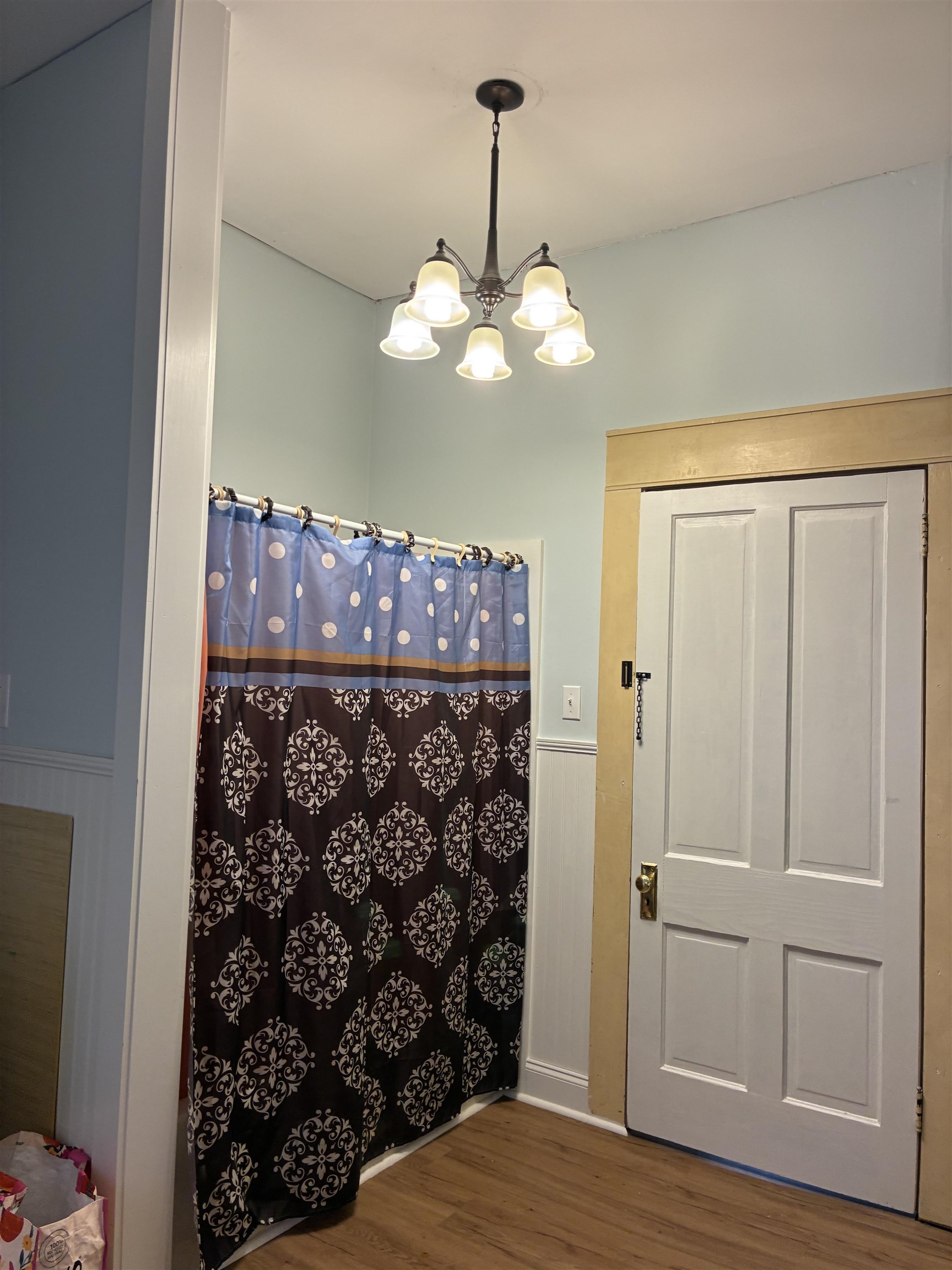 408 East Main Street Newbern, TN 38059 - Photo 11 of 30 a view of a chandelier fan and wooden floor