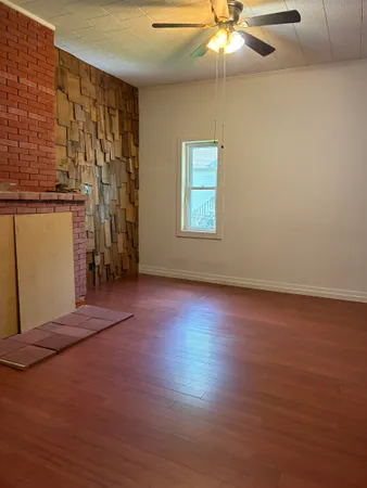 a bedroom with a bed and a wall painting