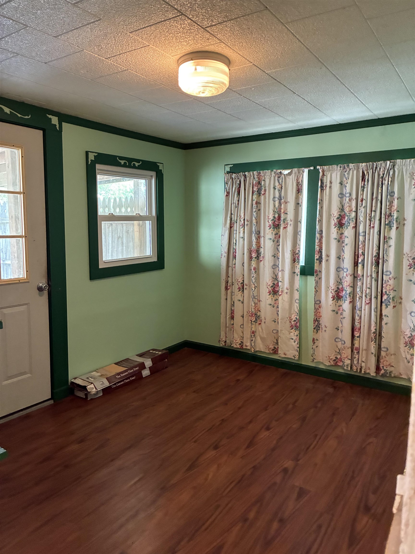 408 East Main Street Newbern, TN 38059 - Photo 21 of 30 an empty room with wooden floor and windows