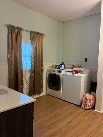 a bathroom with a sink vanity and toilet