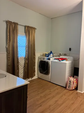 a bathroom with a sink vanity and toilet