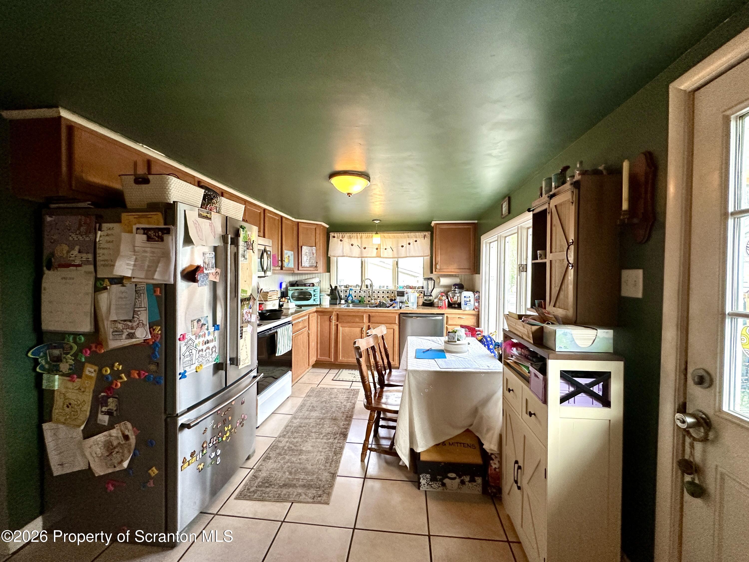 544 Green Street Duryea, PA 18642 - Photo 4 of 14 a kitchen with stainless steel appliances a refrigerator and a refrigerator
