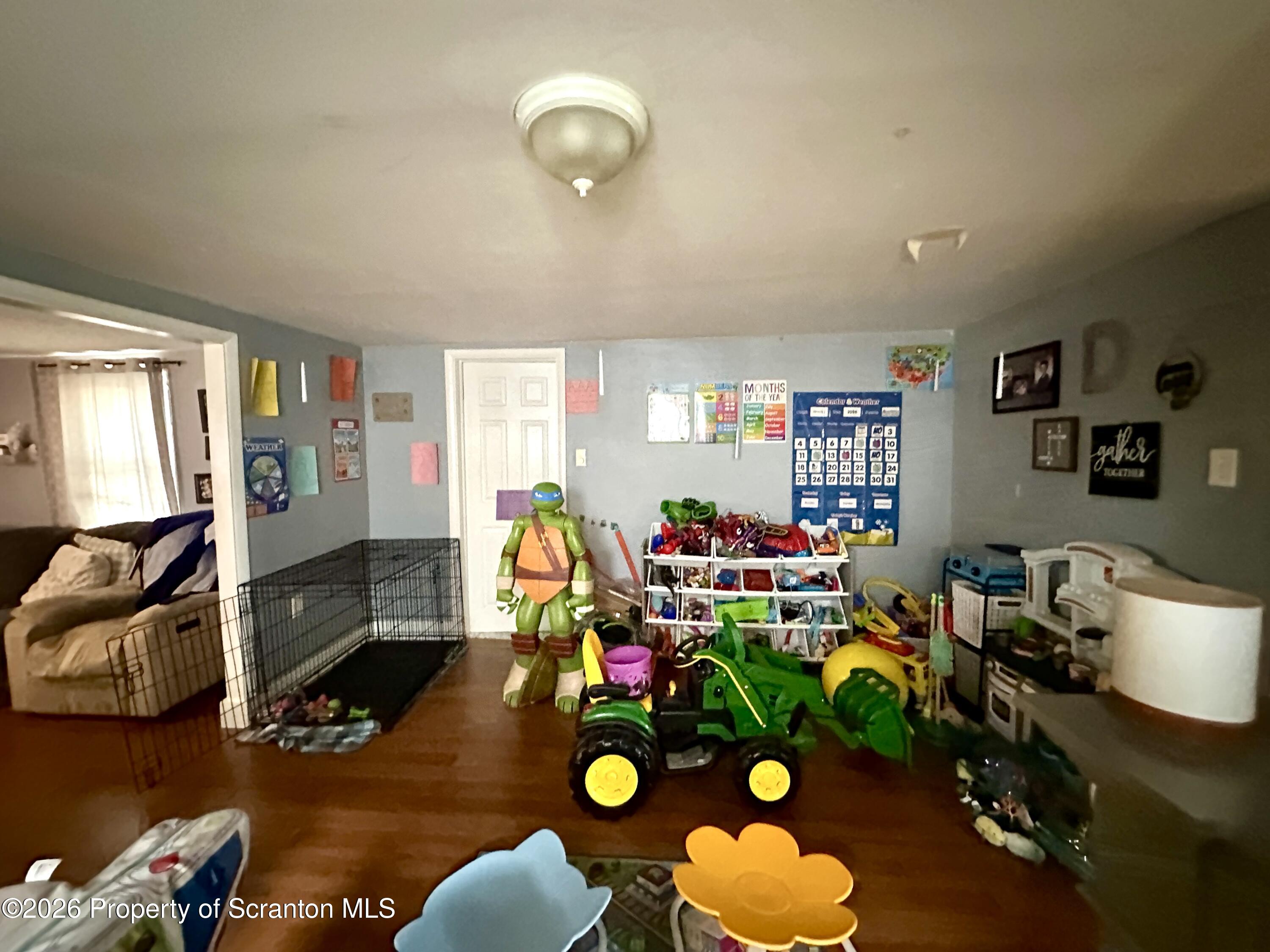 544 Green Street Duryea, PA 18642 - Photo 6 of 14 a room with furniture and a wooden floor