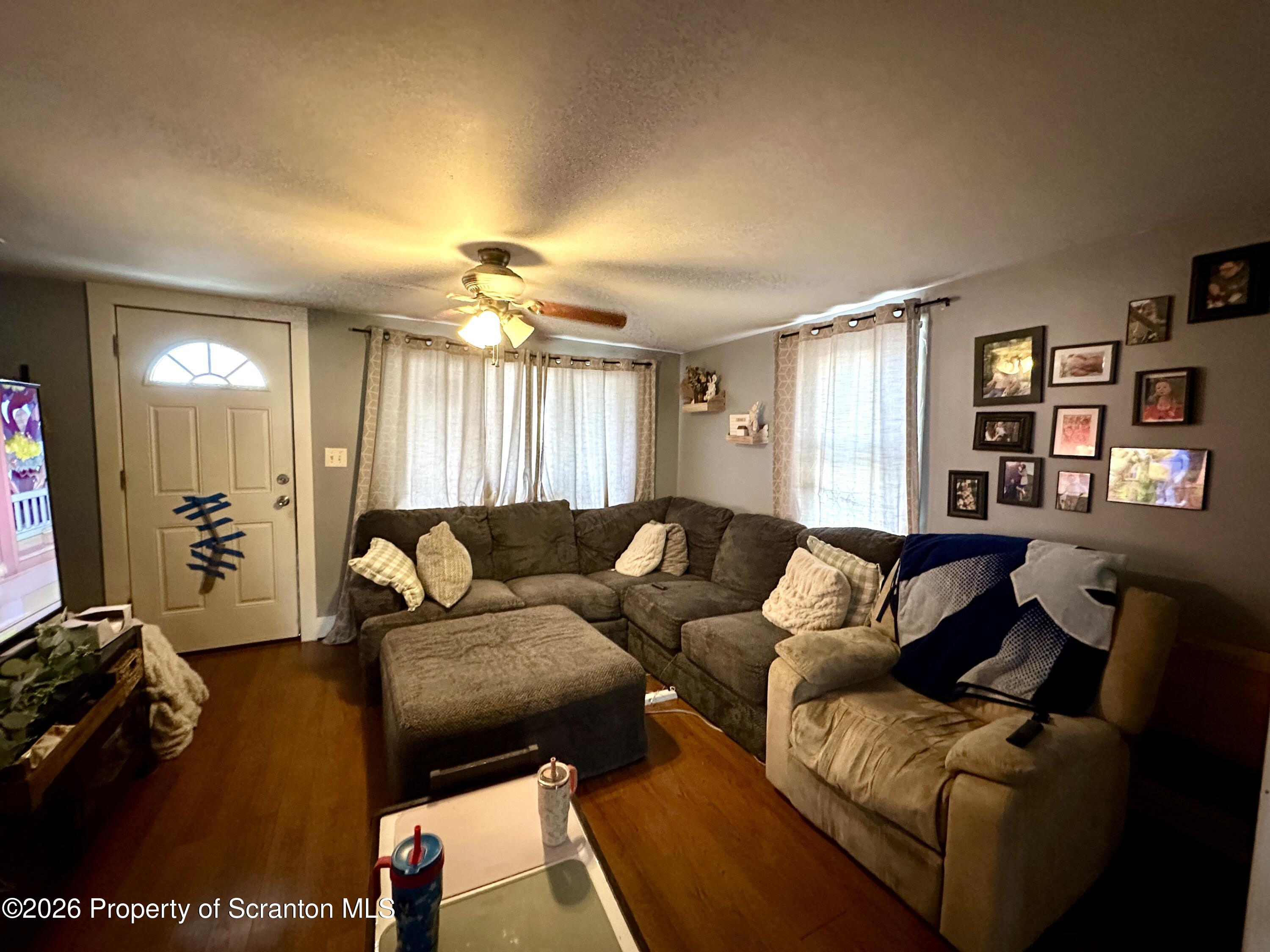 544 Green Street Duryea, PA 18642 - Photo 7 of 14 a living room with furniture and a wooden floor