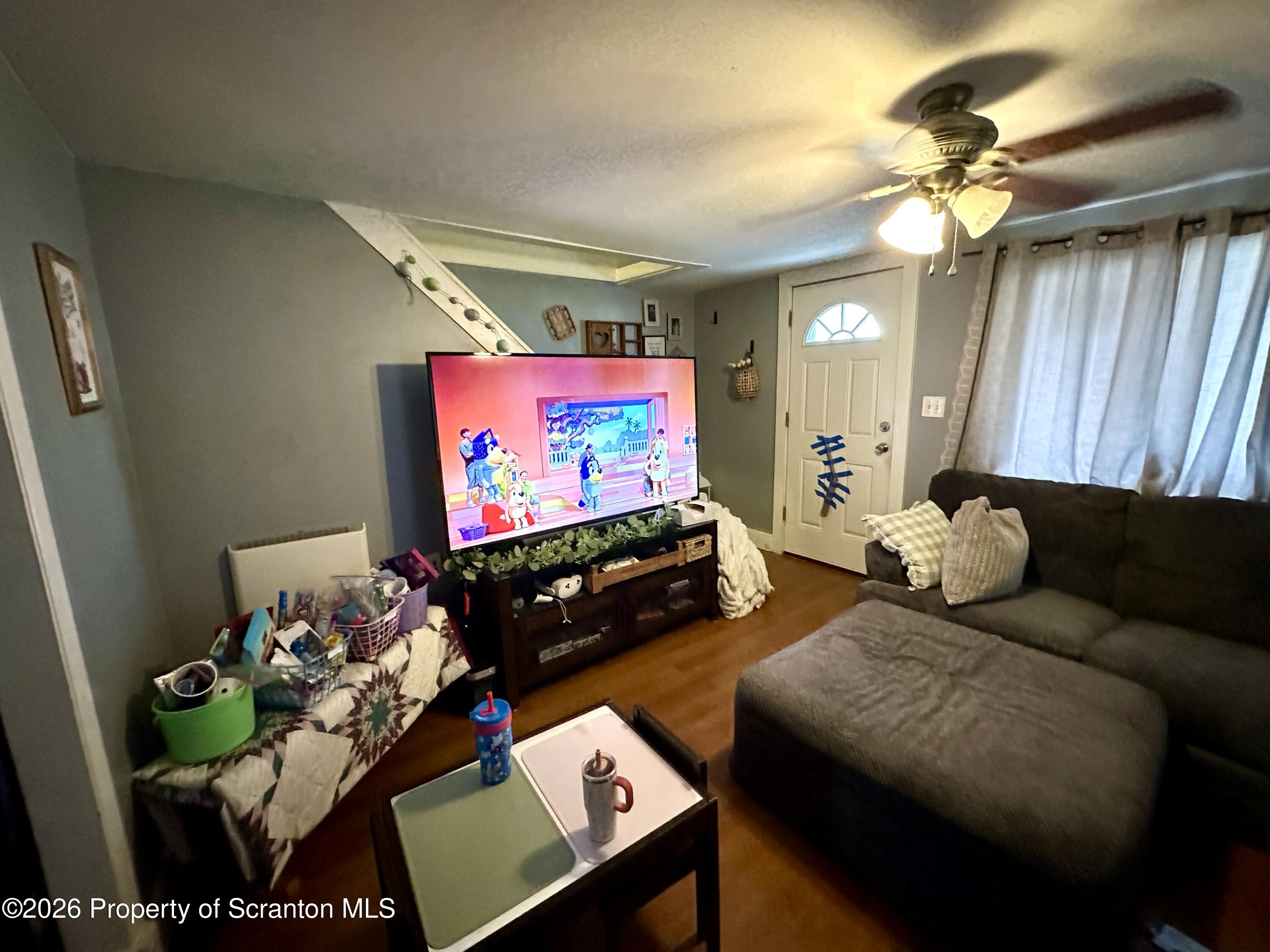 544 Green Street Duryea, PA 18642 - Photo 8 of 14 a living room with furniture and a flat screen tv