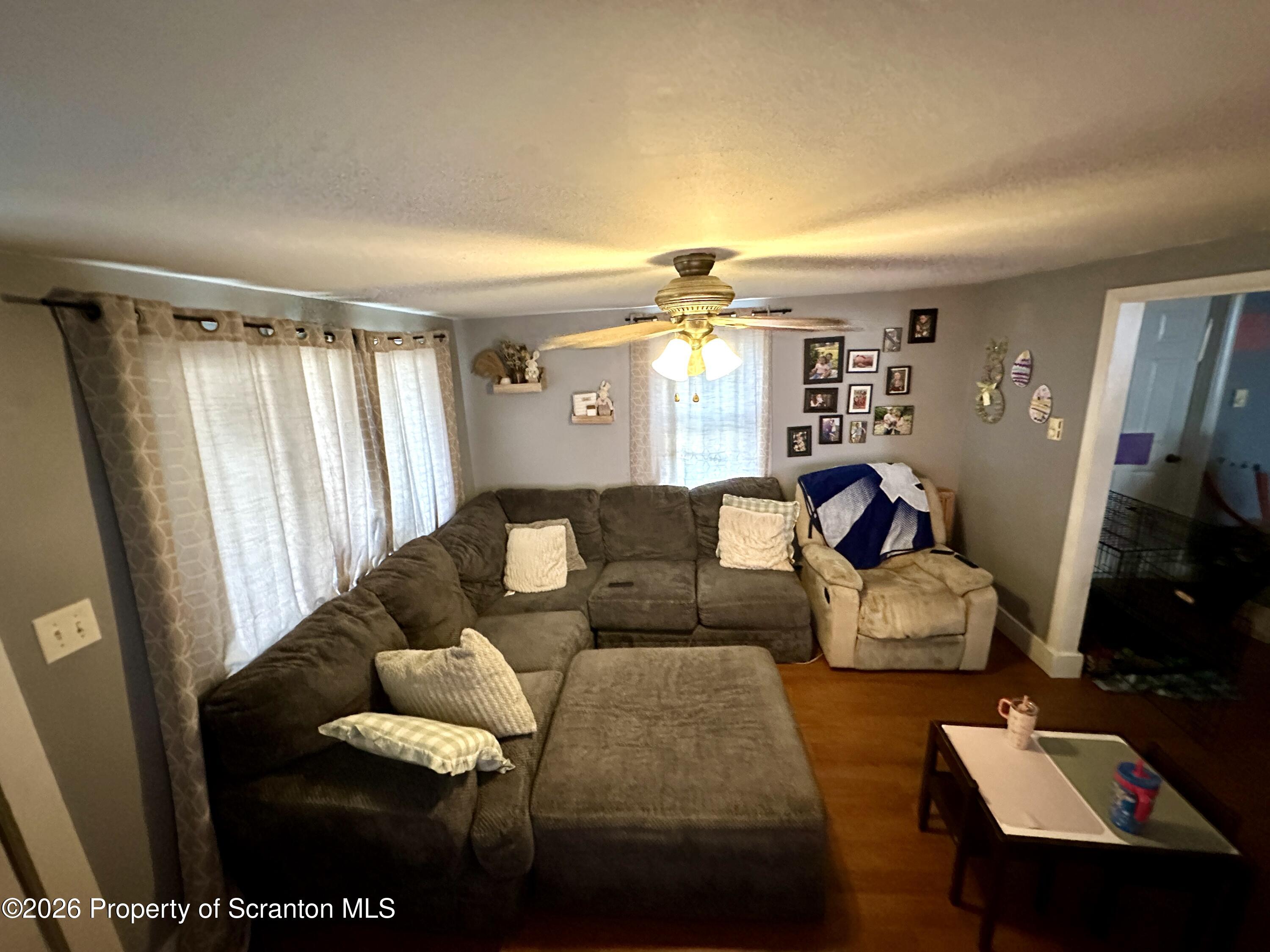 544 Green Street Duryea, PA 18642 - Photo 10 of 14 a living room with furniture and a flat screen tv