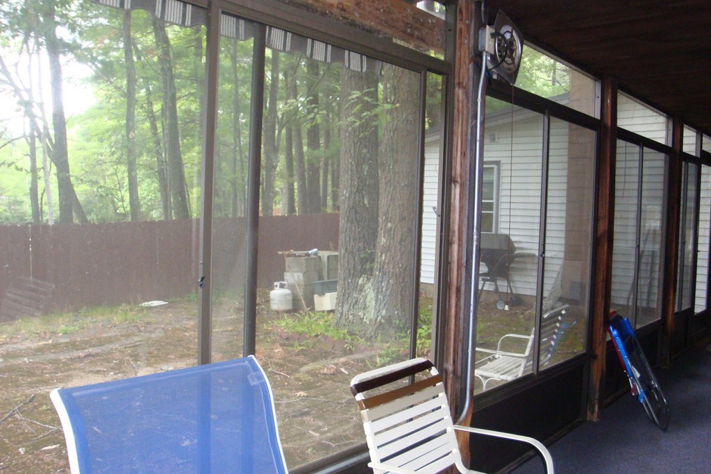 379 Townsend Harbor Road Lunenburg, MA 01462 - Photo 13 of 21 a view of a balcony and floor to ceiling window
