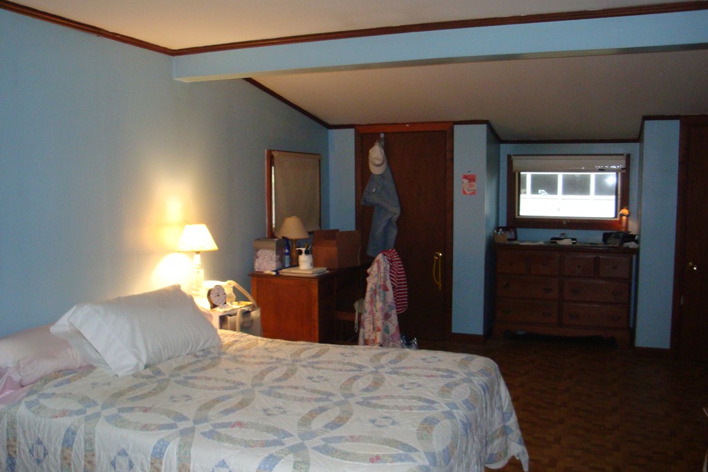 379 Townsend Harbor Road Lunenburg, MA 01462 - Photo 17 of 21 a bedroom with a bed and wooden floor