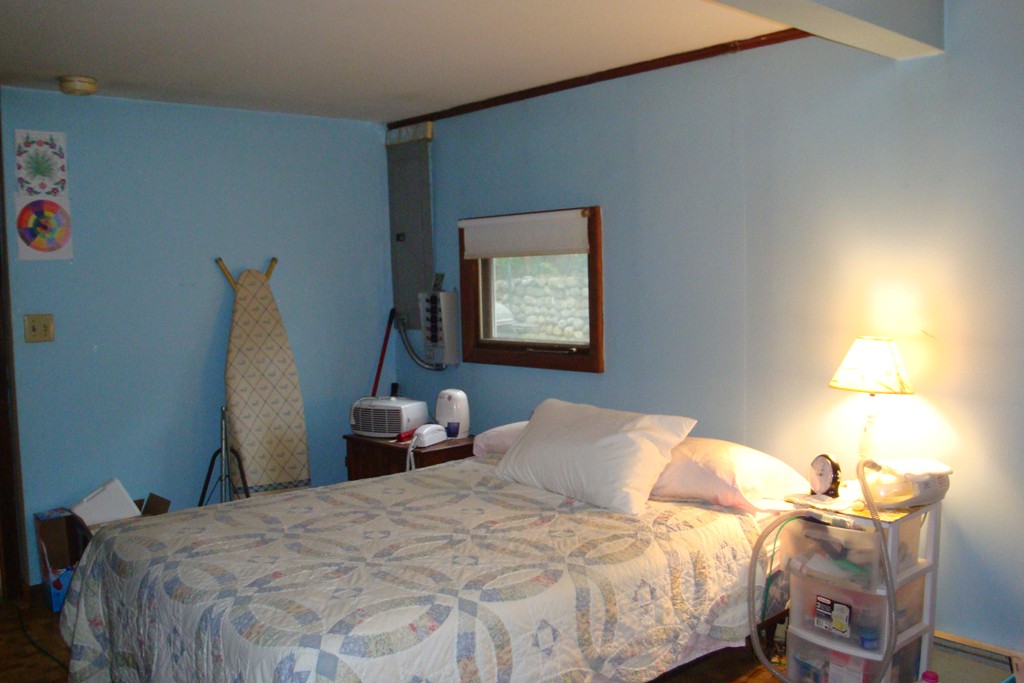 379 Townsend Harbor Road Lunenburg, MA 01462 - Photo 18 of 21 a bedroom with a bed and a table in it