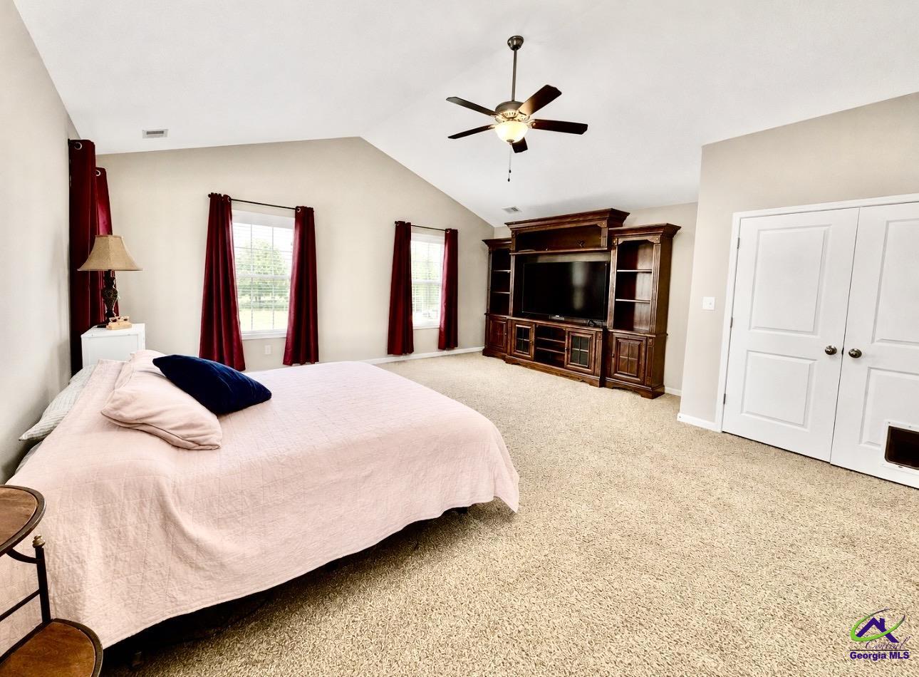600 Post Oak Way Warner Robins, GA 31088 - Photo 31 of 50 a bedroom with a large bed and ceiling fan