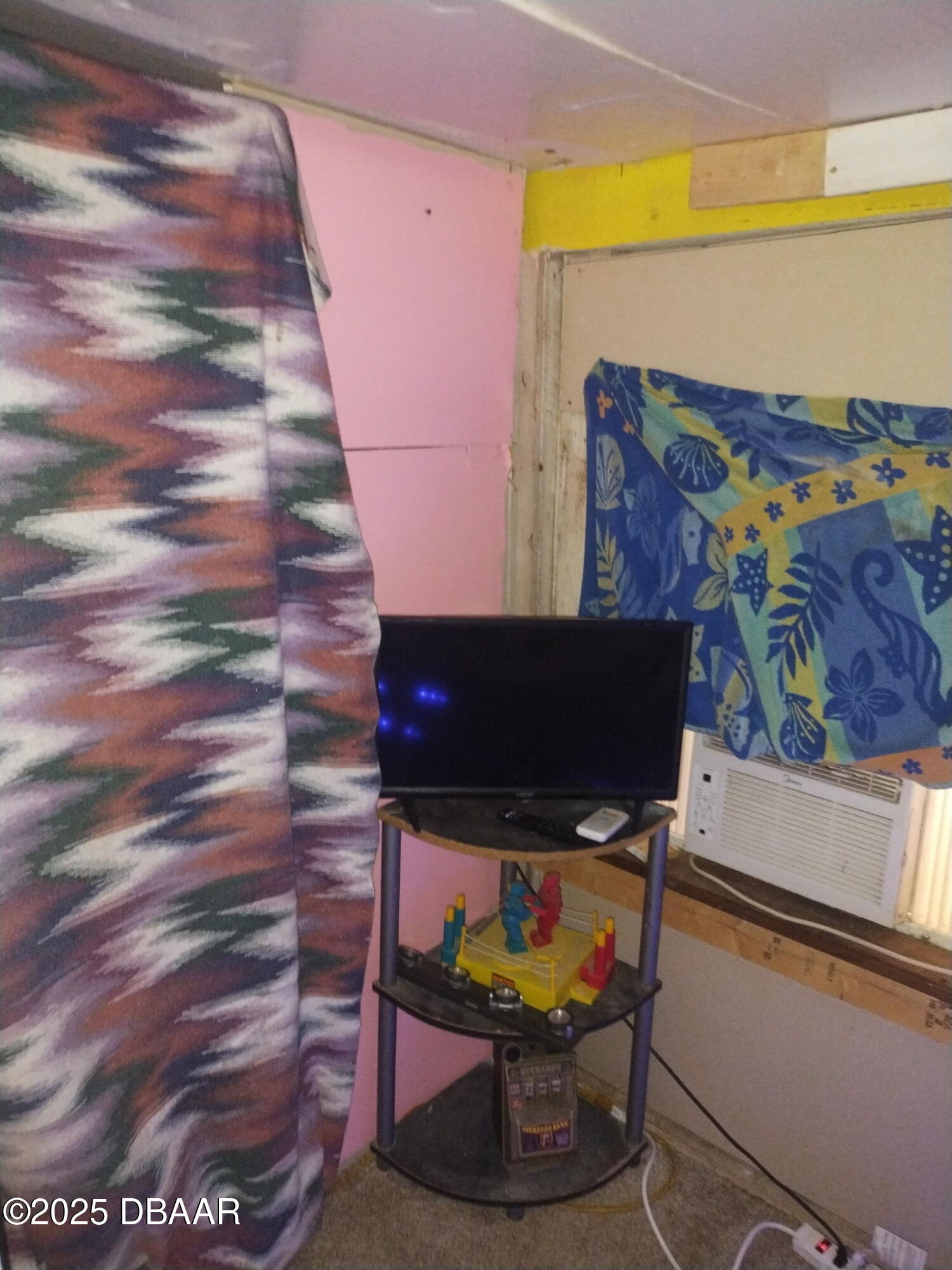 56337 Blue Creek Road Astor, FL 32102 - Photo 14 of 22 a living room with furniture and a flat screen tv