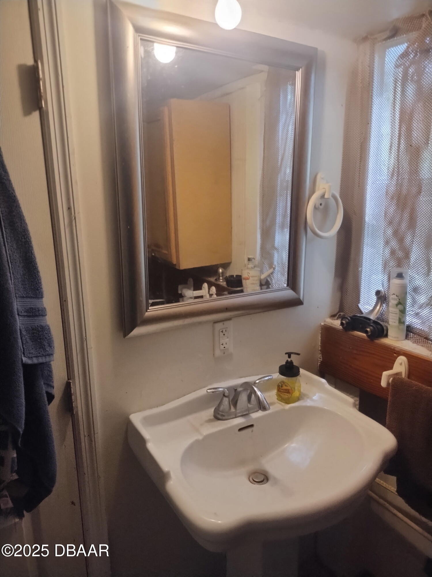 56337 Blue Creek Road Astor, FL 32102 - Photo 15 of 22 a bathroom with a sink and a mirror