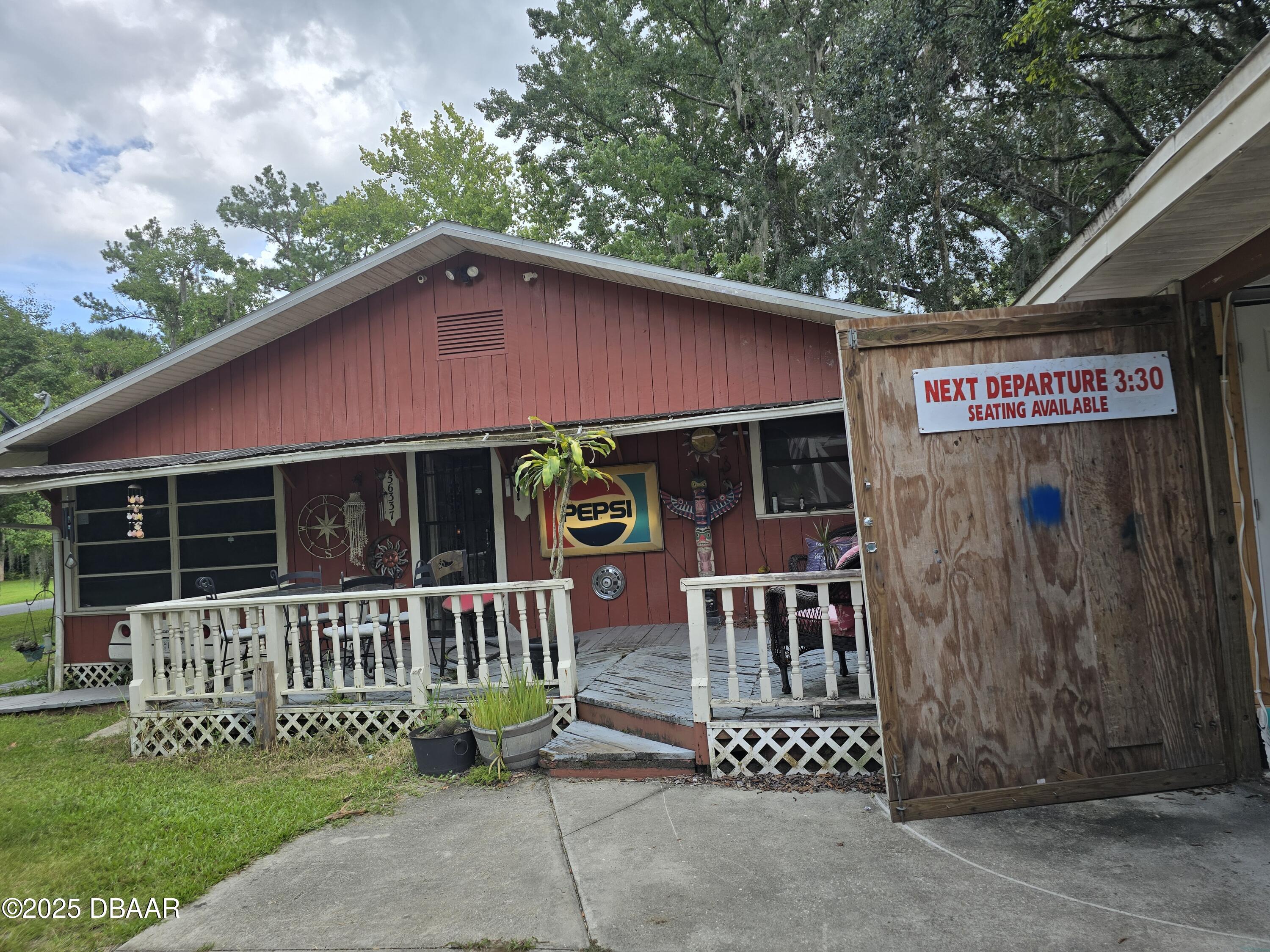 56337 Blue Creek Road Astor, FL 32102 - Photo 3 of 22 a view of a house with a yard and sitting area