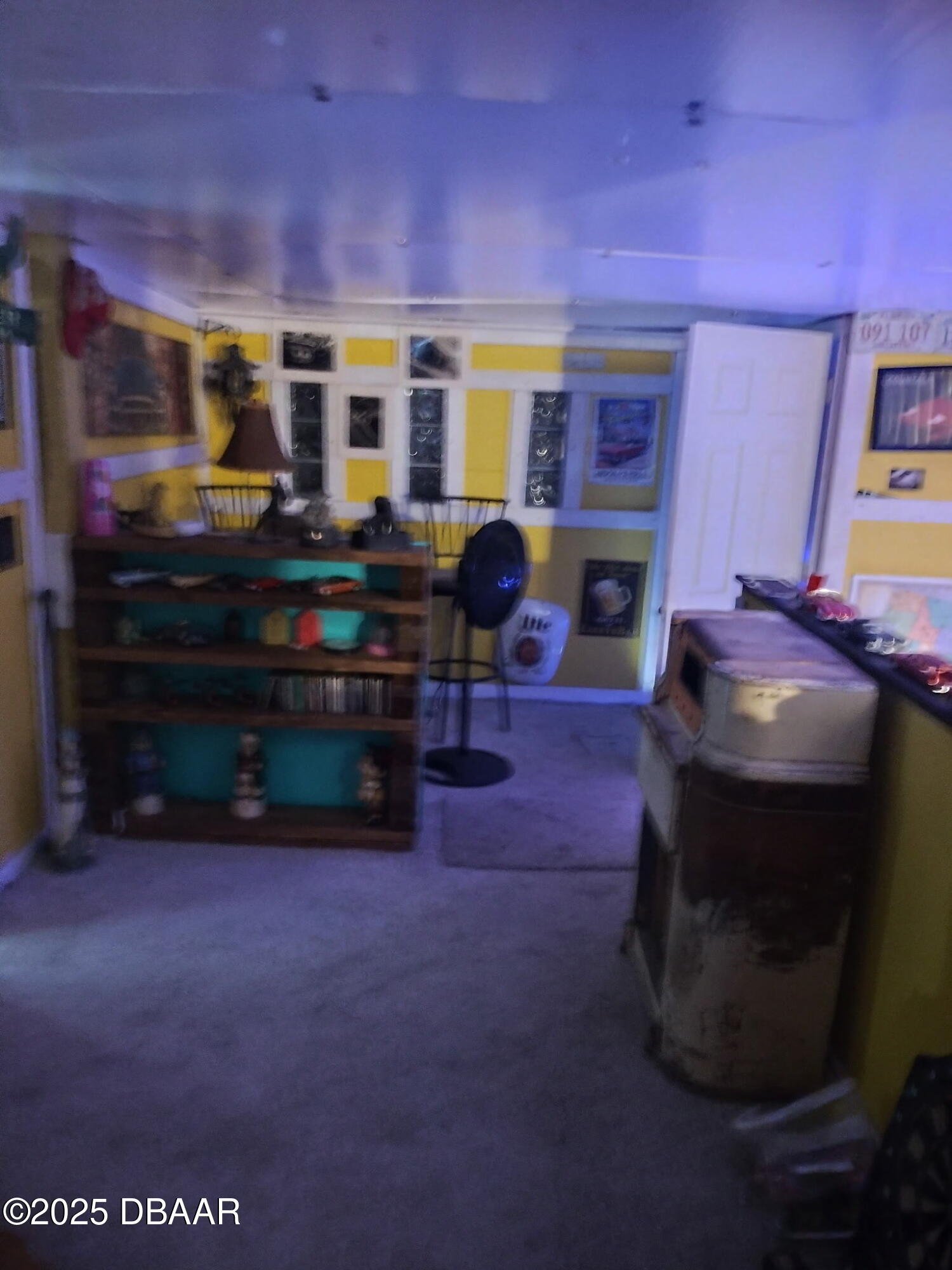 56337 Blue Creek Road Astor, FL 32102 - Photo 8 of 22 a living room with furniture a fireplace and a flat screen tv