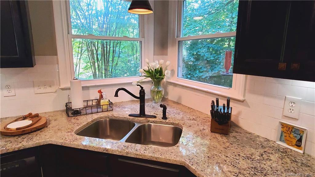 20700 Willow Pond Road Cornelius, NC 28031 - Photo 13 of 47 a kitchen with a sink a counter top space and a wooden floor