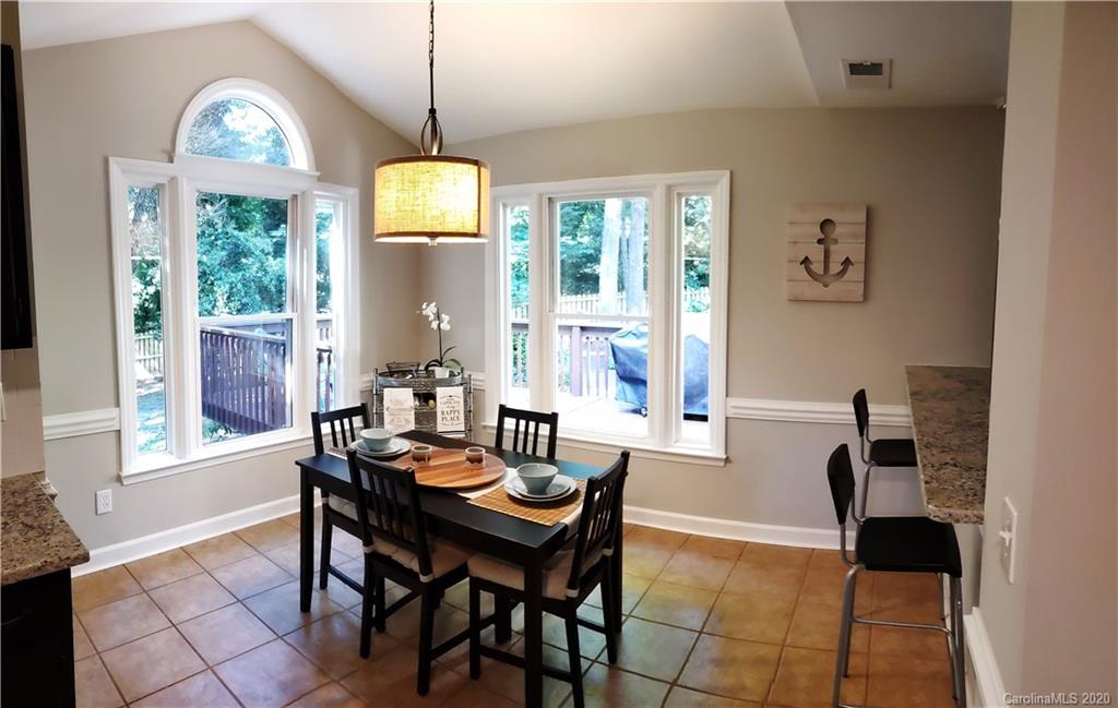 20700 Willow Pond Road Cornelius, NC 28031 - Photo 18 of 47 a dining room with furniture and window