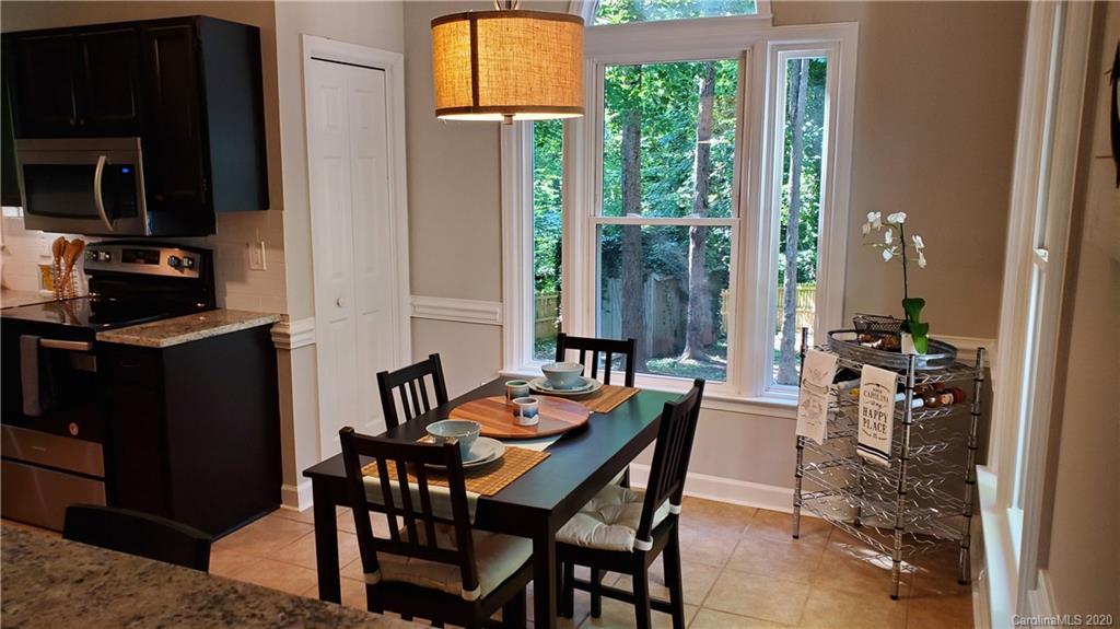 20700 Willow Pond Road Cornelius, NC 28031 - Photo 19 of 47 a view of a dining room with furniture window and outside view