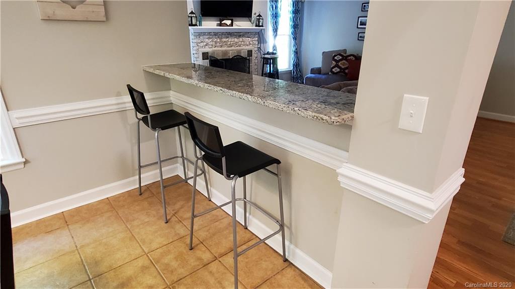 20700 Willow Pond Road Cornelius, NC 28031 - Photo 20 of 47 a dining room with furniture and wooden floor