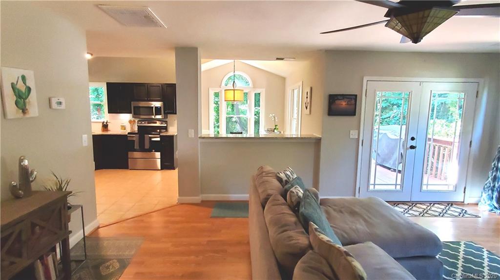 20700 Willow Pond Road Cornelius, NC 28031 - Photo 22 of 47 a living room with furniture and a large window