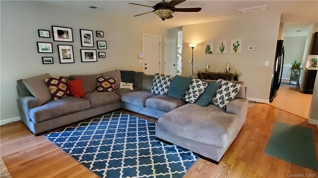 20700 Willow Pond Road Cornelius, NC 28031 - Photo 23 of 47 a living room with furniture and a rug