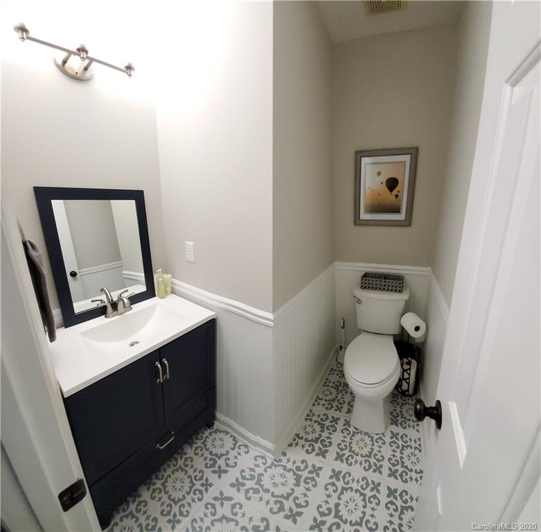 20700 Willow Pond Road Cornelius, NC 28031 - Photo 25 of 47 a bathroom with a toilet sink and mirror