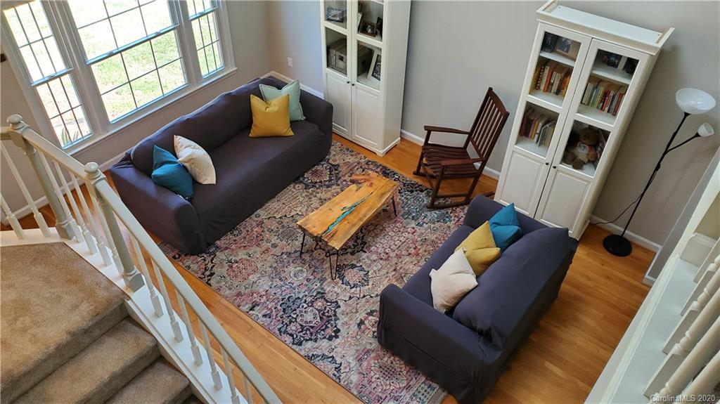 20700 Willow Pond Road Cornelius, NC 28031 - Photo 27 of 47 a living room with furniture and a couch