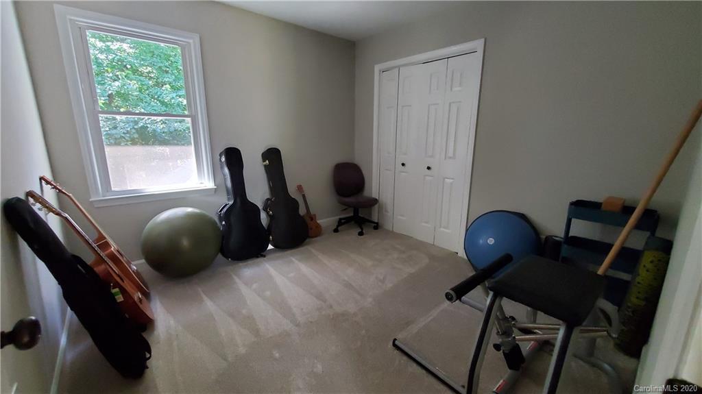 20700 Willow Pond Road Cornelius, NC 28031 - Photo 35 of 47 a room with a chair and gym equipment